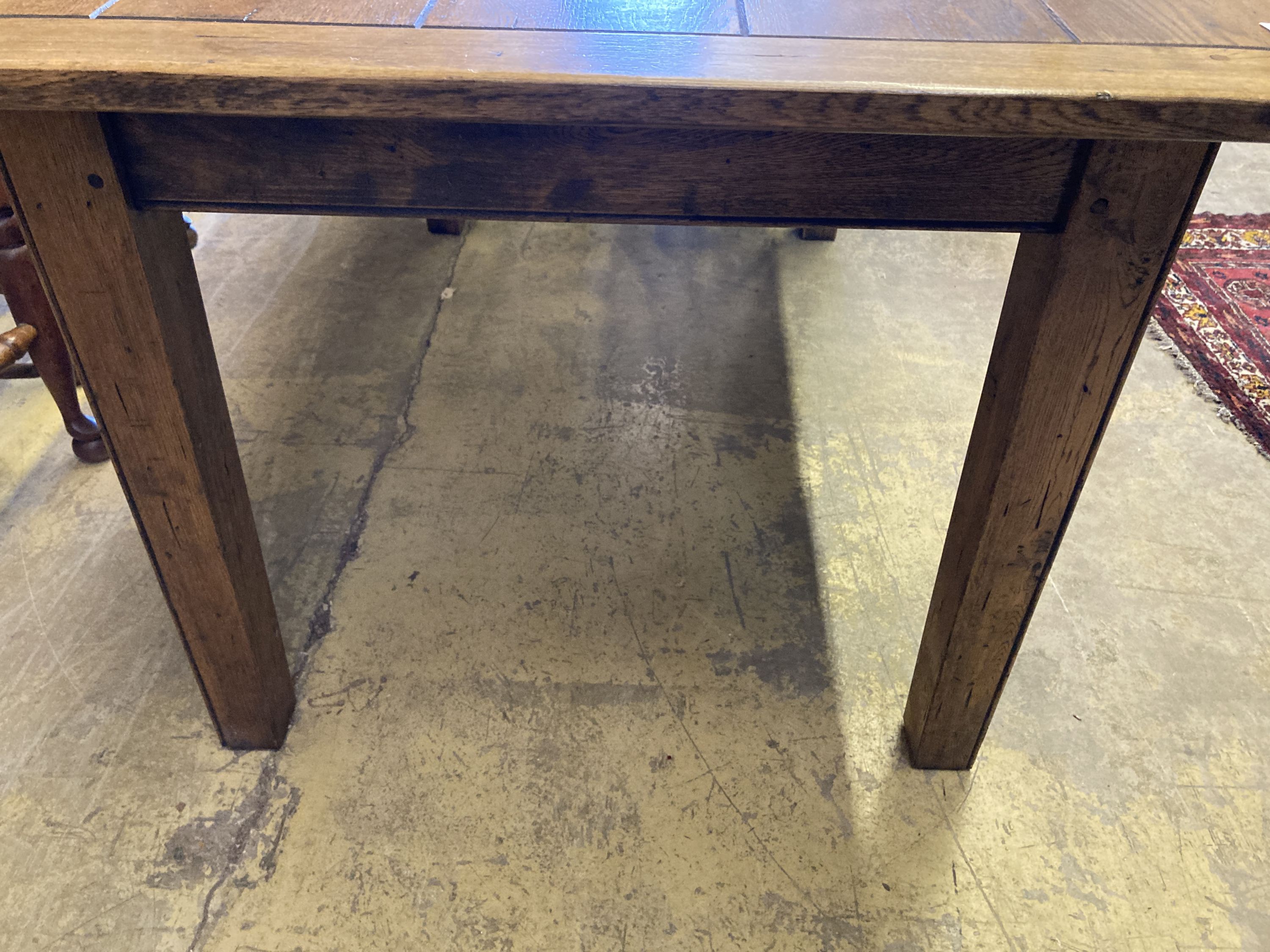 A 19th century style rectangular oak dining table with planked top, length 153cm, depth 90cm, height 77cm